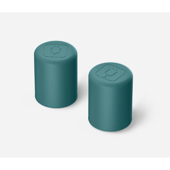 Two teal cylindrical containers with smiley face designs