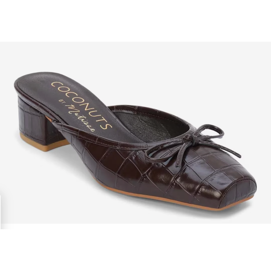 Brown crocodile-patterned shoe with a bow featuring the brand 'Coconuts by Nature'.