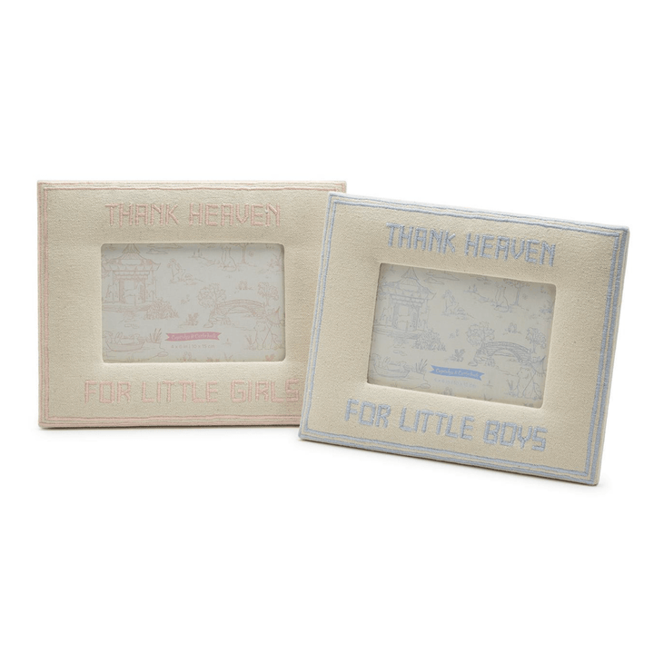 Two beige picture frames with text 'Thank Heaven for little girls' and 'Thank Heaven for little boys'