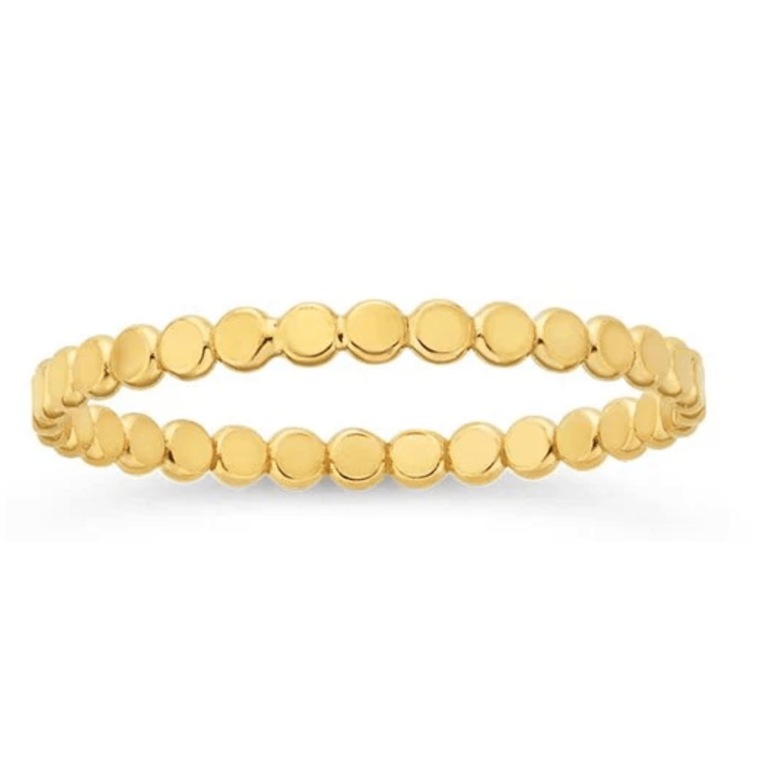 Gold beaded ring on a white background