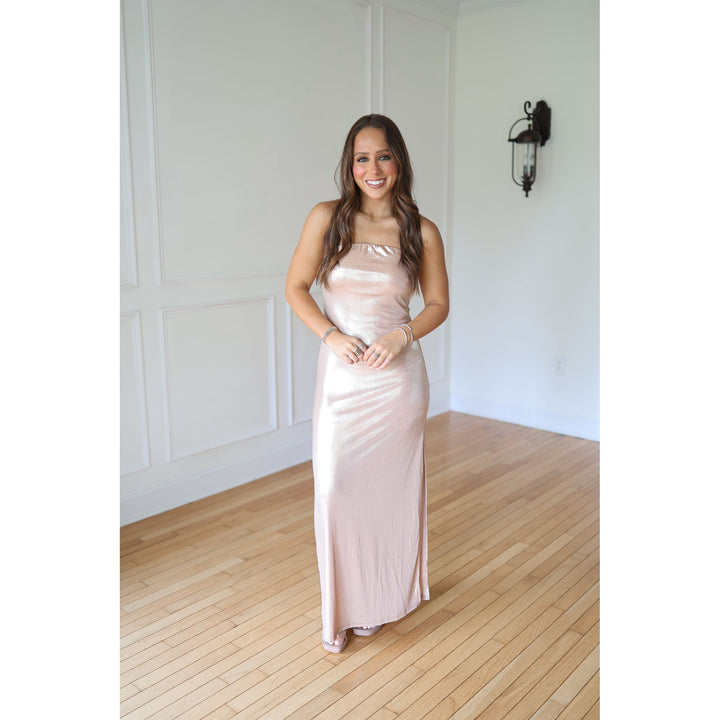 Woman in a long, champagne-colored dress 