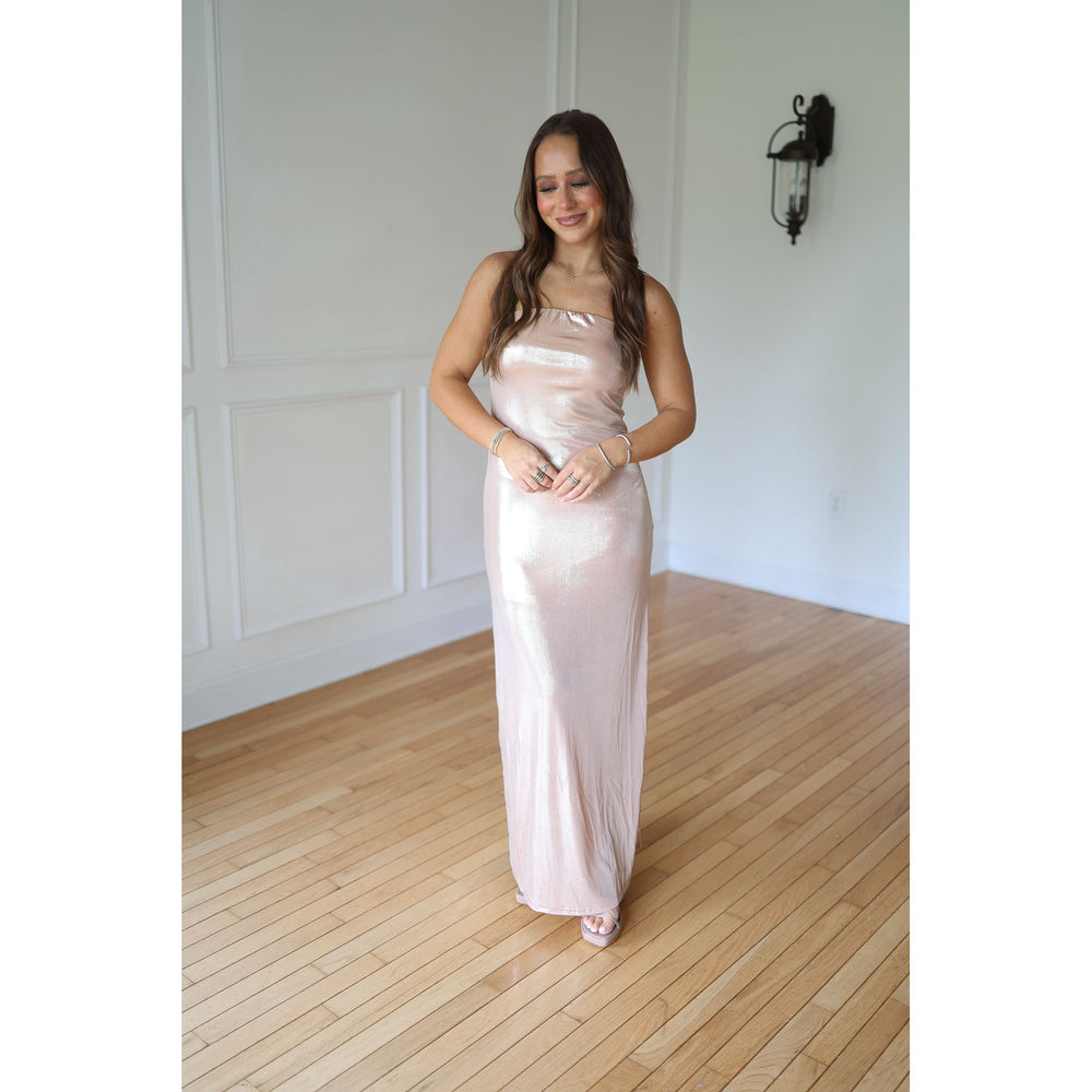 Woman in a long, champagne-colored dress 