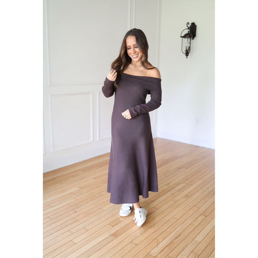 Woman wearing a long, off-shoulder dress 