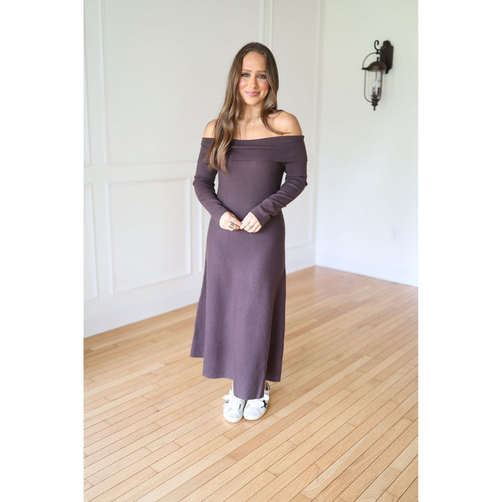 Woman wearing a long brown dress 