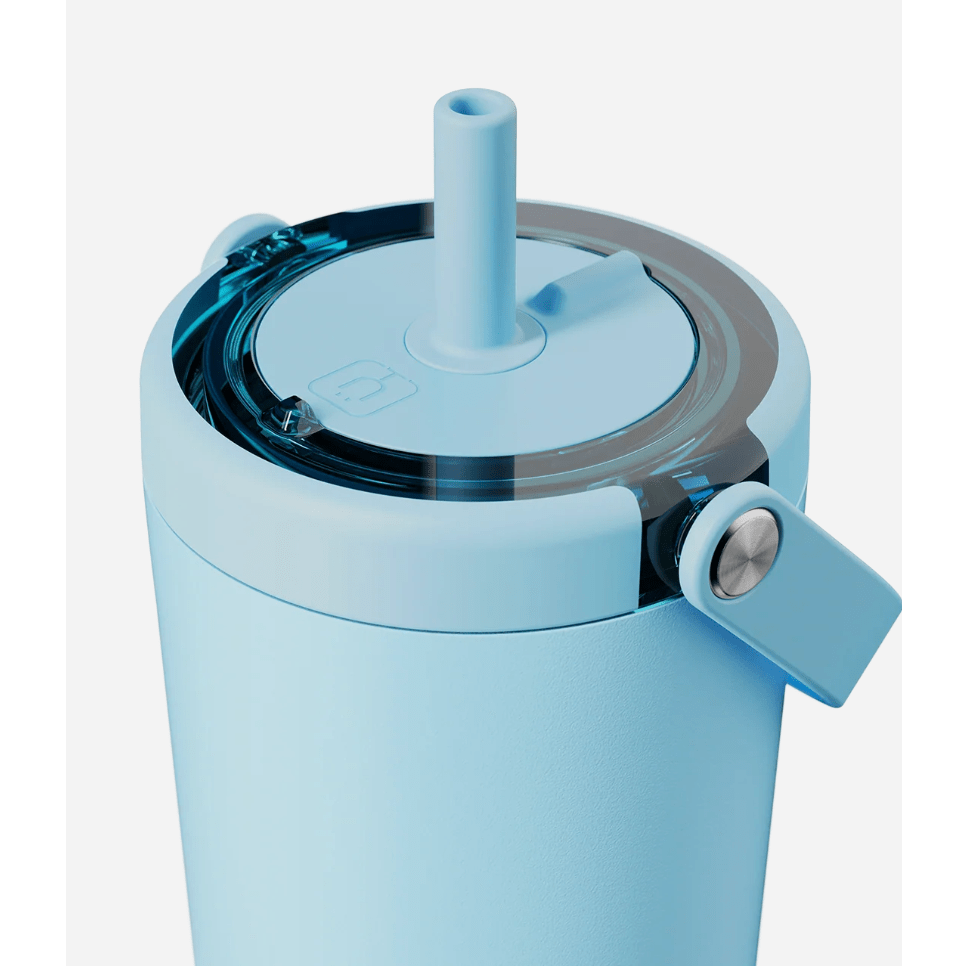 Light blue tumbler with a straw lid on a white background