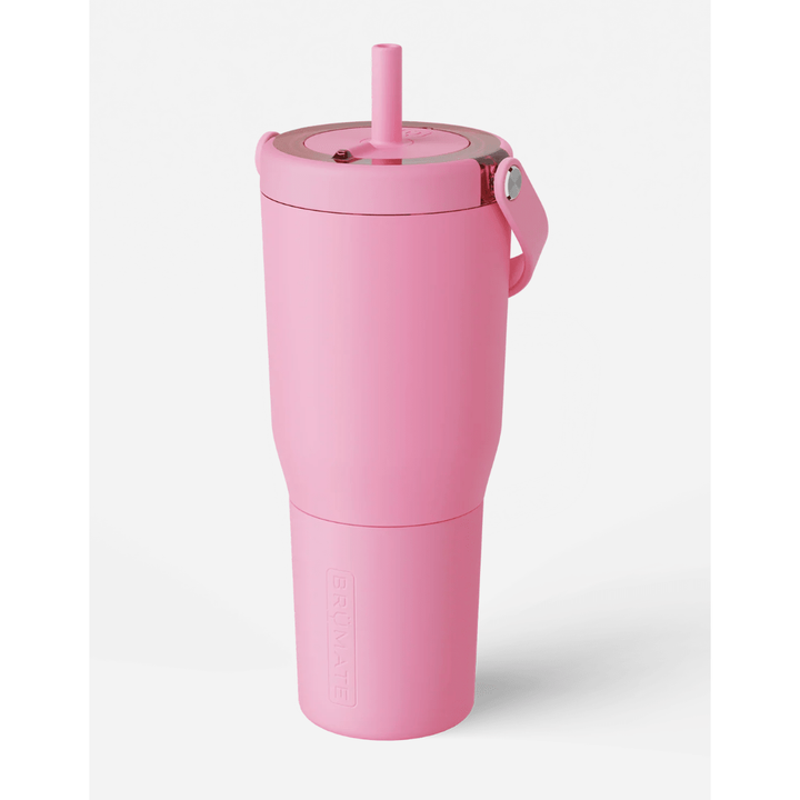 Pink tumbler with a straw on a white background