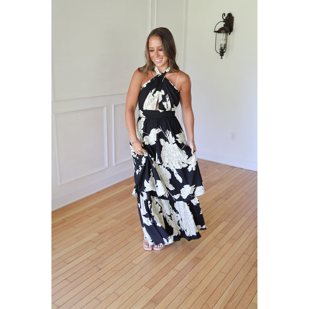 Woman wearing a black and white floral dress 