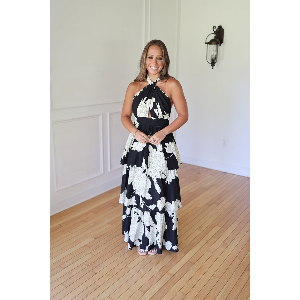 Woman wearing a black and white floral dress 