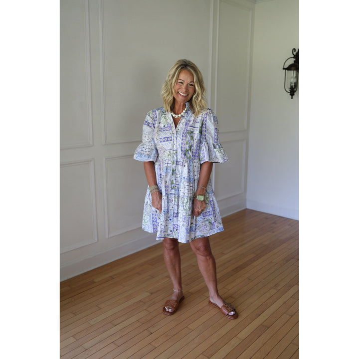 Woman wearing a blue patterned dress 