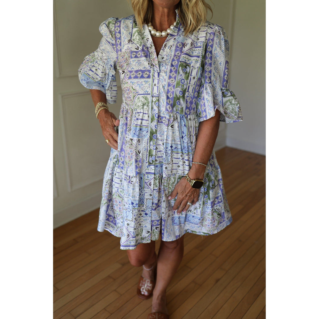 Woman wearing a blue patterned dress 