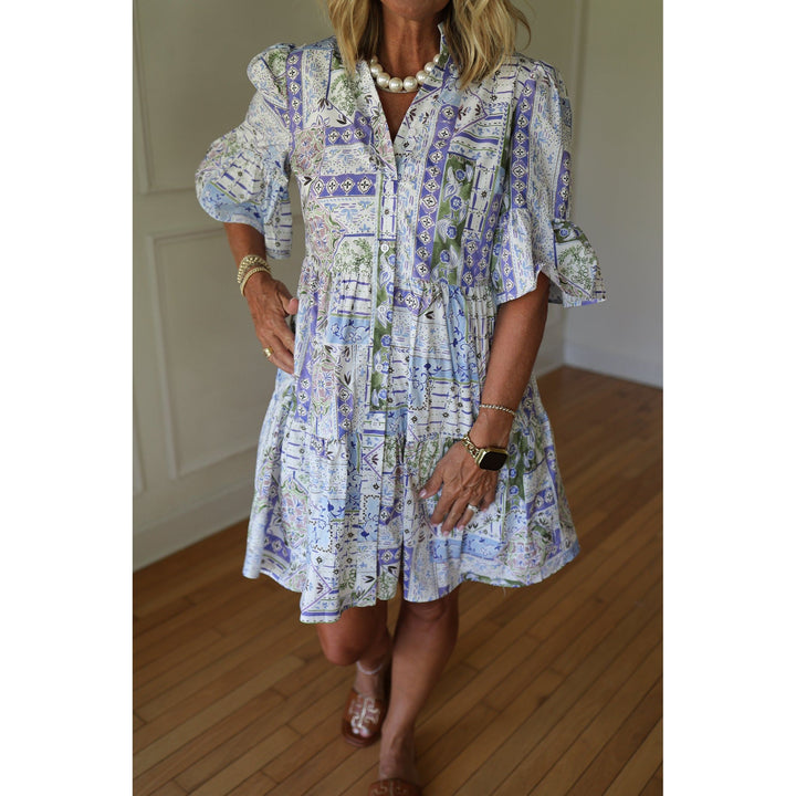 Woman wearing a blue patterned dress 
