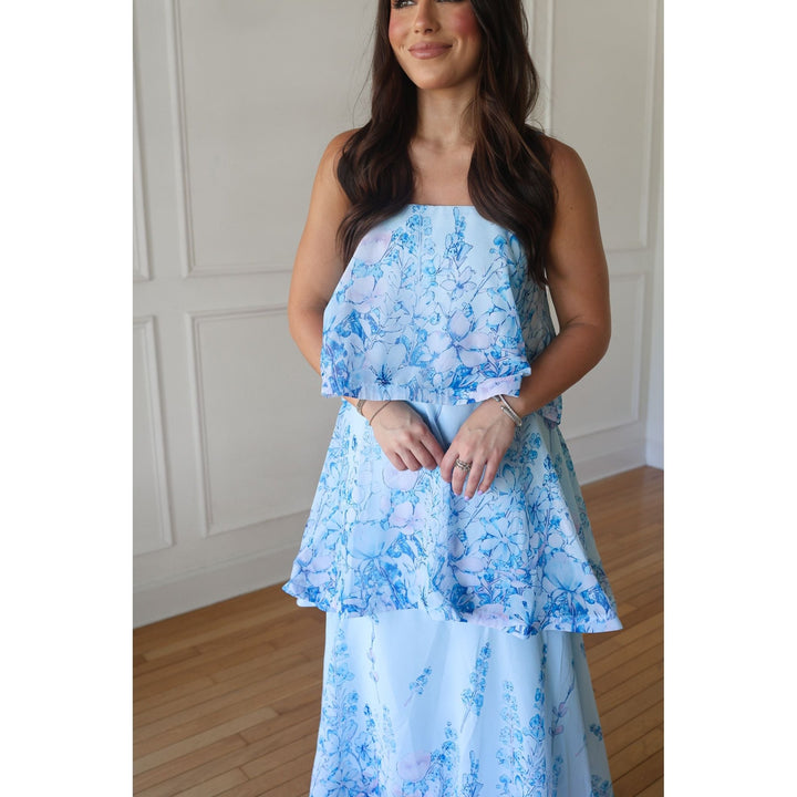 woman wearing blue floral maxi dress