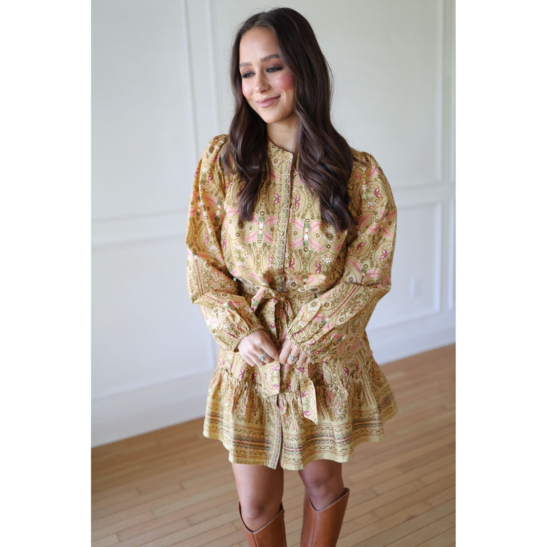 Woman wearing a floral dress with long sleeves 