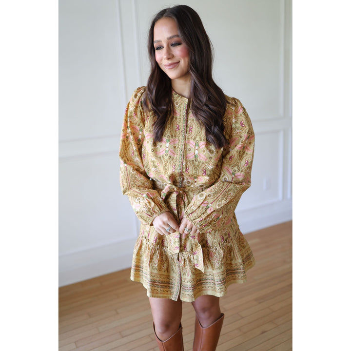 Woman wearing a floral dress with long sleeves 