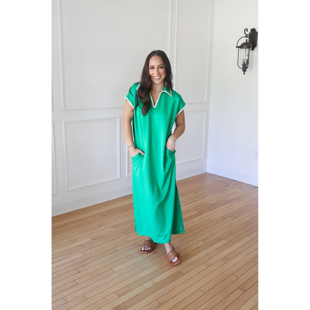 woman wearing green maxi dress