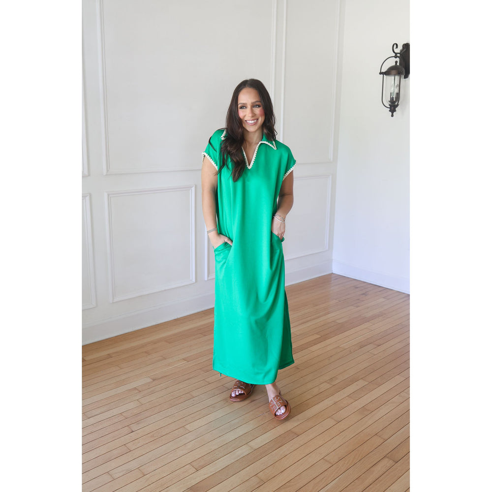 woman wearing green maxi dress