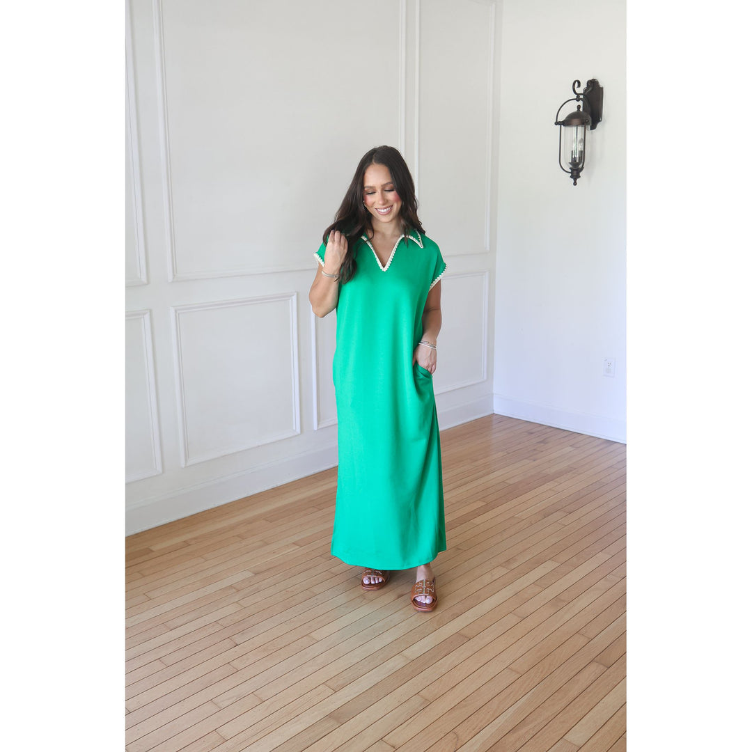 woman wearing green maxi dress