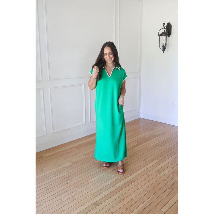 woman wearing green maxi dress