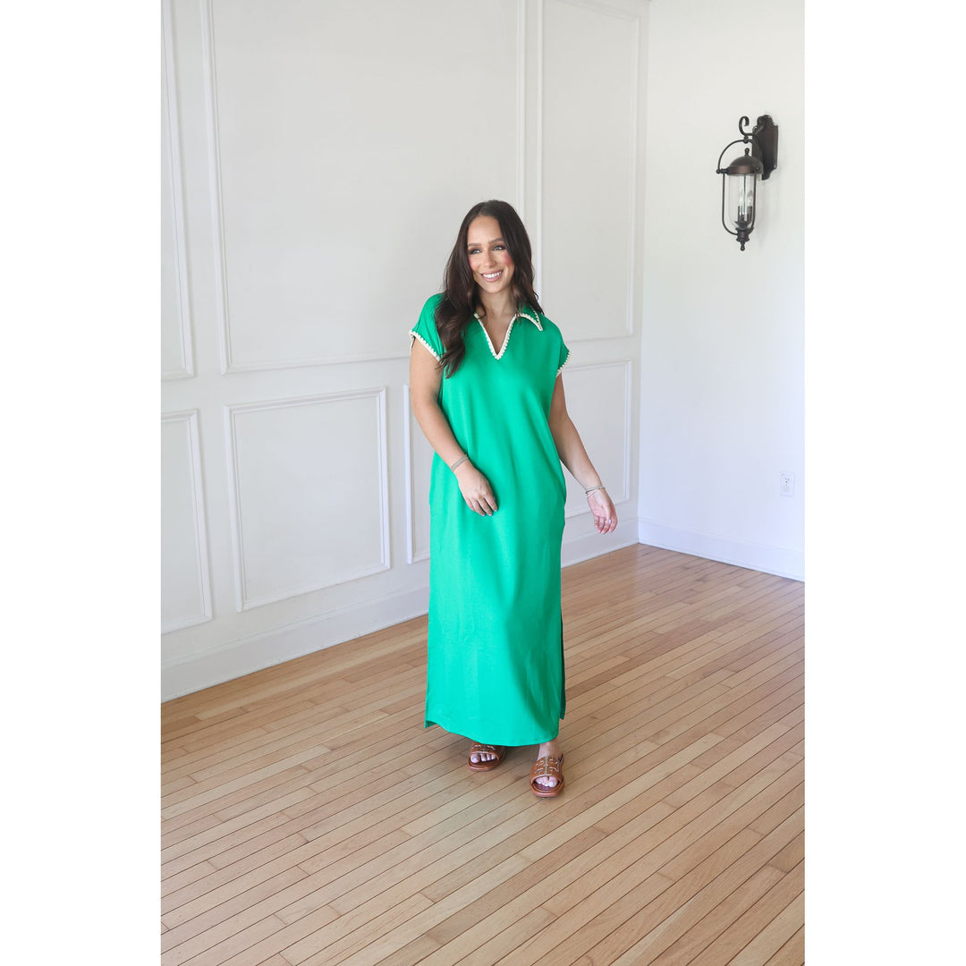 woman wearing a green maxi dress