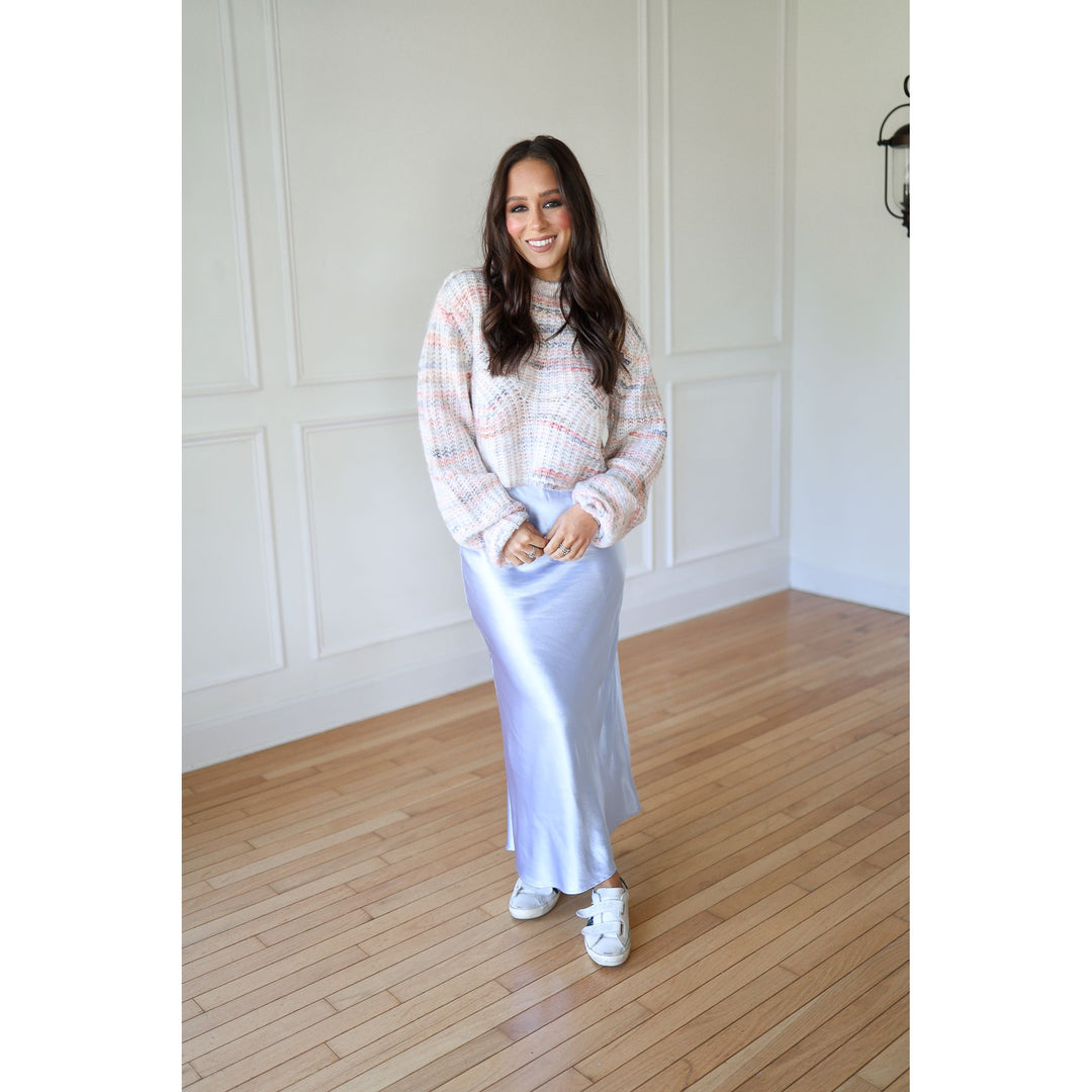 Woman in a plaid shirt and white skirt 