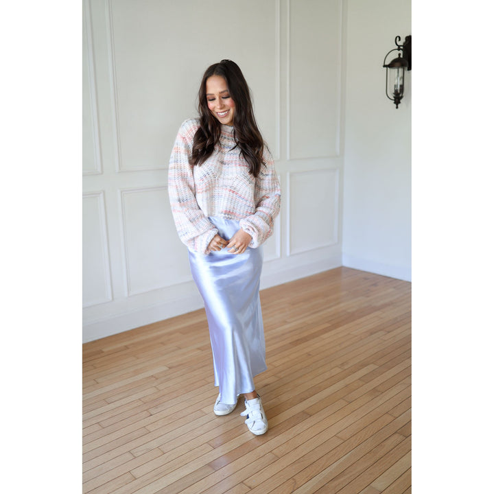 Woman in a checkered blouse and white skirt 