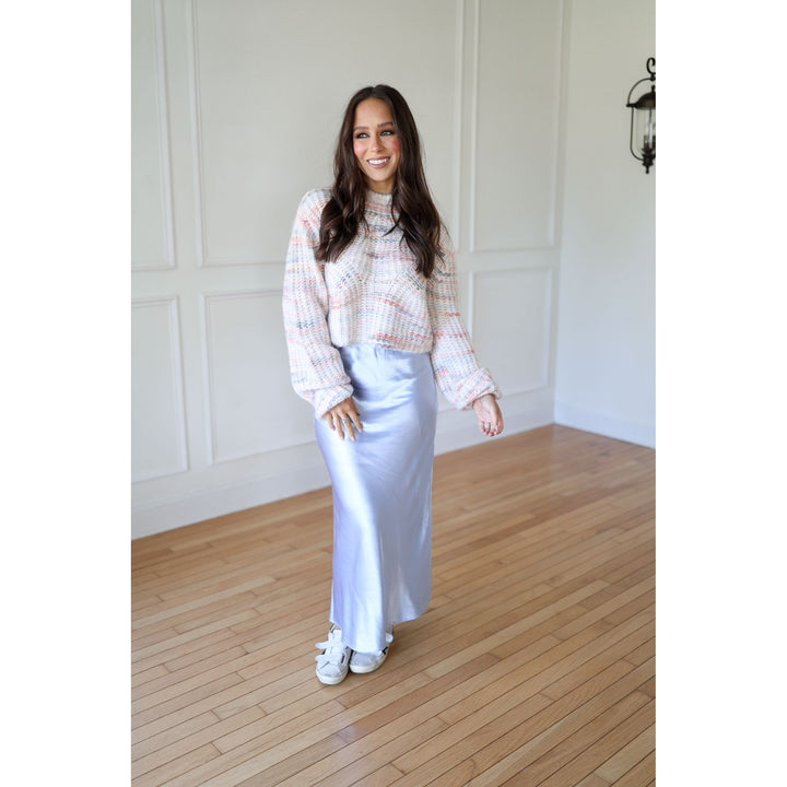 Woman wearing a plaid shirt and light blue 