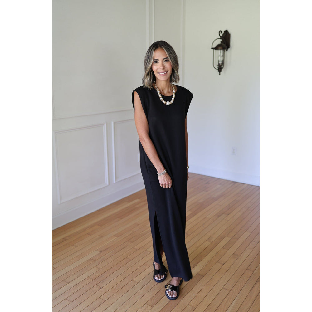 Woman wearing a black sleeveless dress 