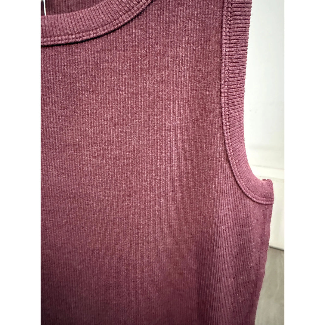 Close-up of a textured wine sleeveless top 