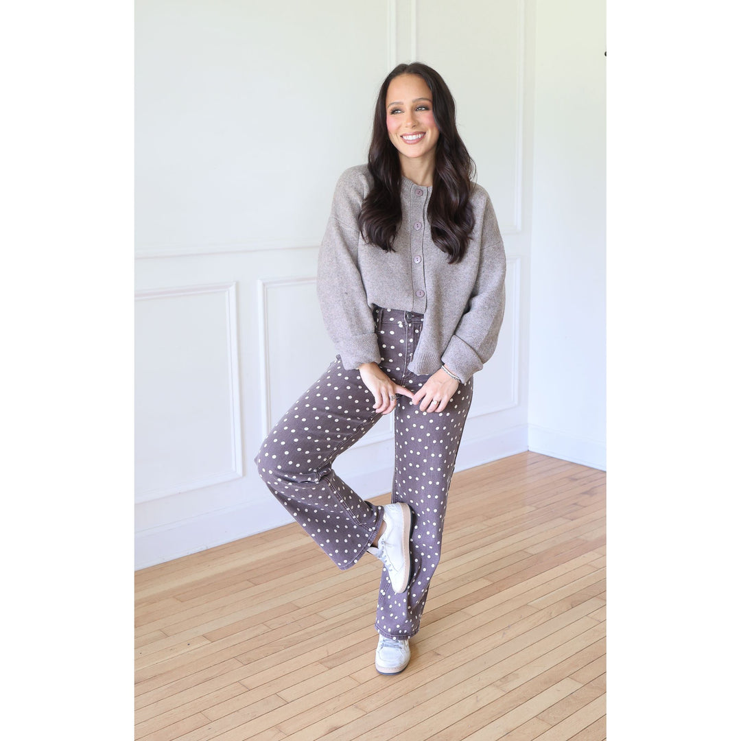 woman wearing mocha cardigan with brown pants with white polka dots and sneakers