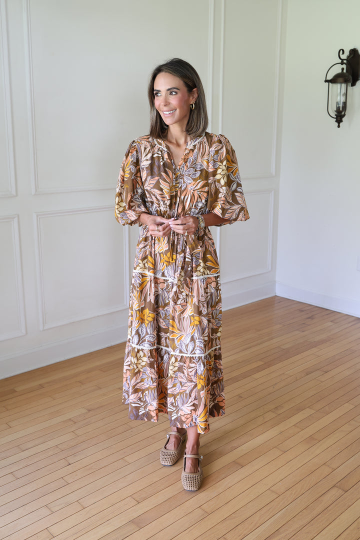 woman wearing brown midi dress