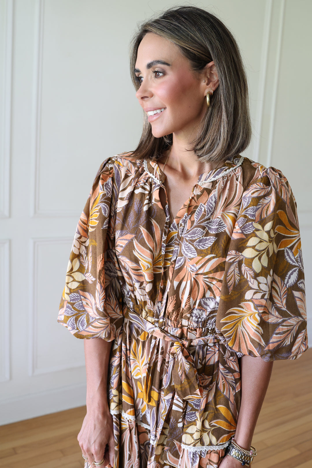 woman wearing brown midi dress