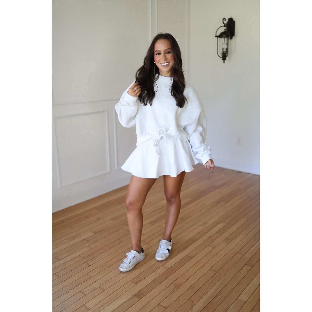 Woman in a gray outfit