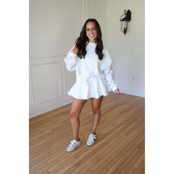 Woman in a gray outfit