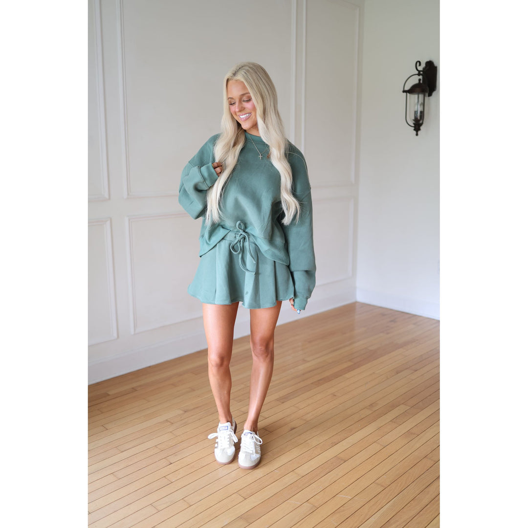 Woman wearing a teal outfit 