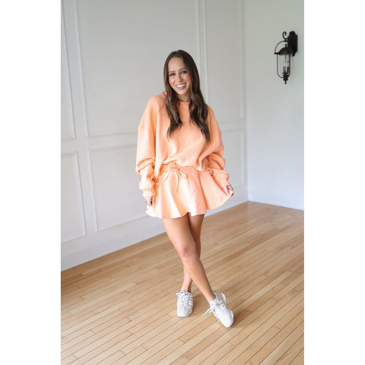 Woman in coral outfit 