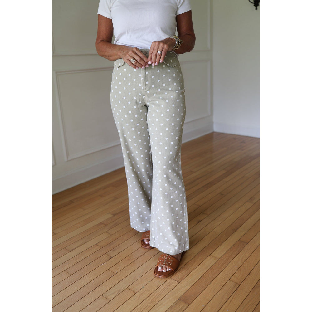 Person wearing taupe polka dot pants 