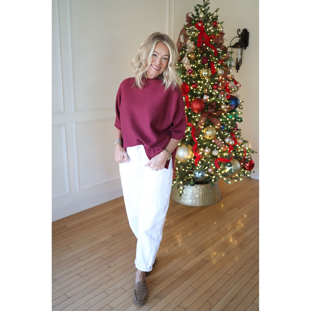 woman wearing burgundy top