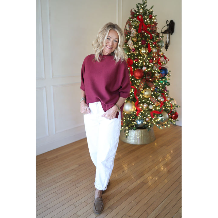 woman wearing burgundy top