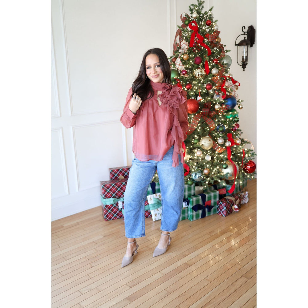 woman in rust blouse