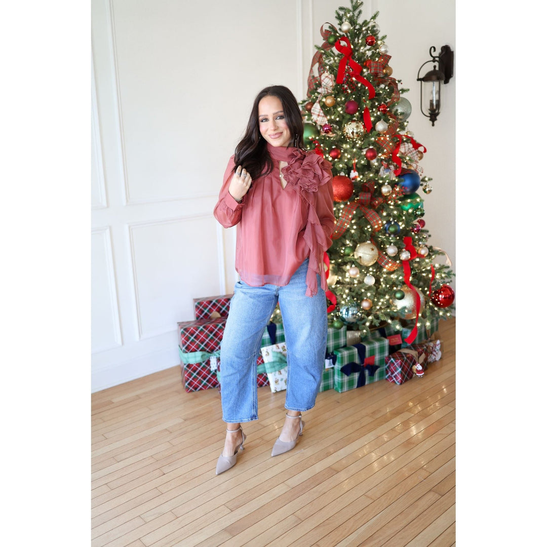 woman in rust blouse