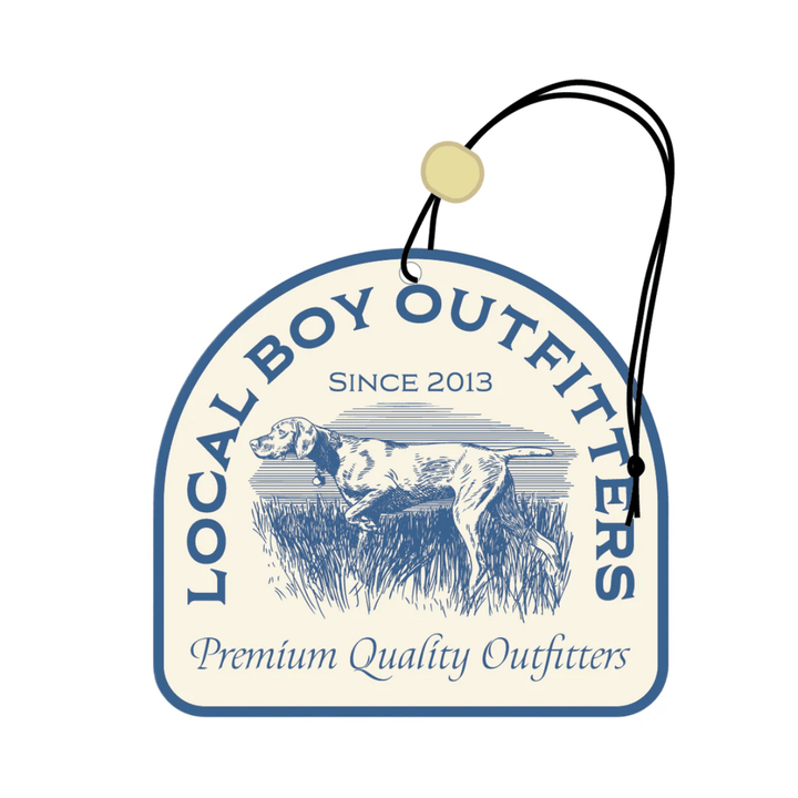 Car air freshener with 'Local Boy Outfitters' branding and a dog illustration on a white background.