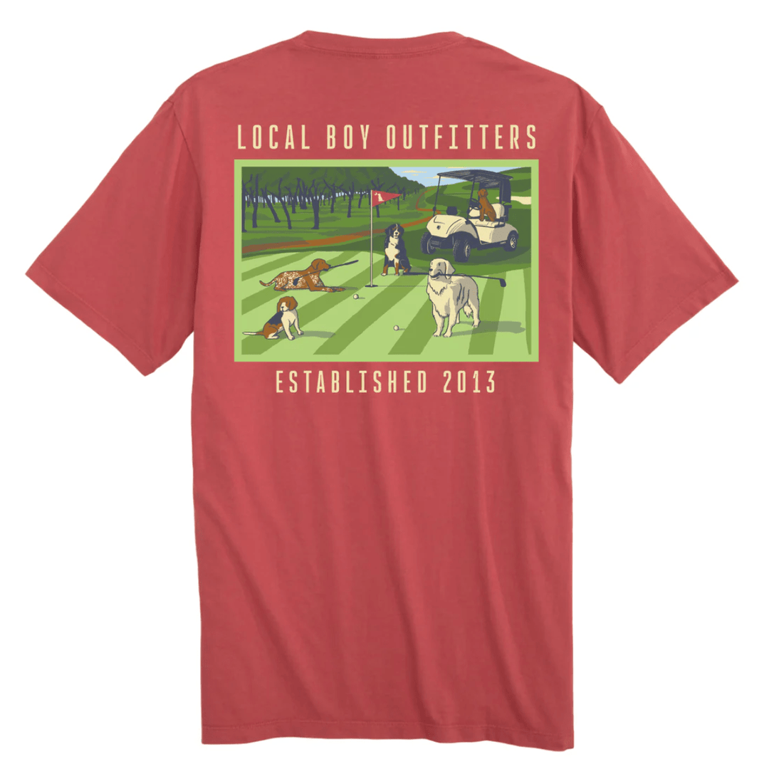 Red t-shirt with a graphic of dogs playing golf and 'Local Boy Outfitters' branding on the back.