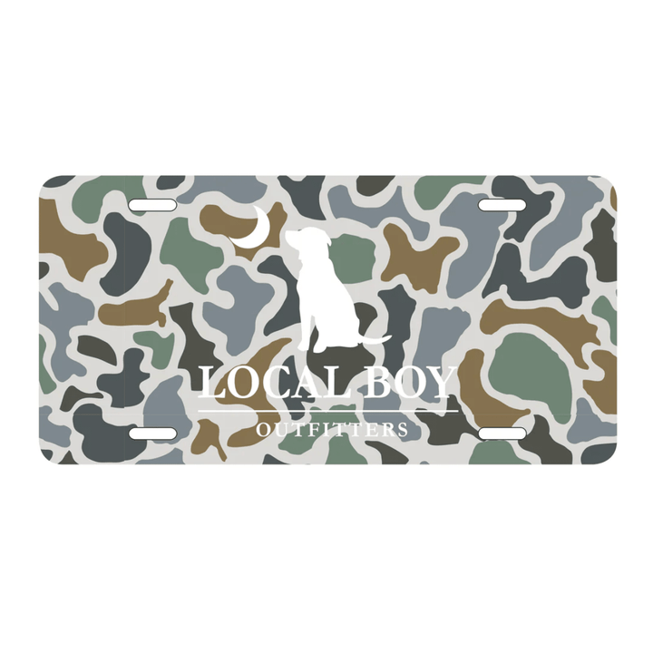 Camouflage-patterned license plate with 'Local Boy Outfitters' branding on a white background