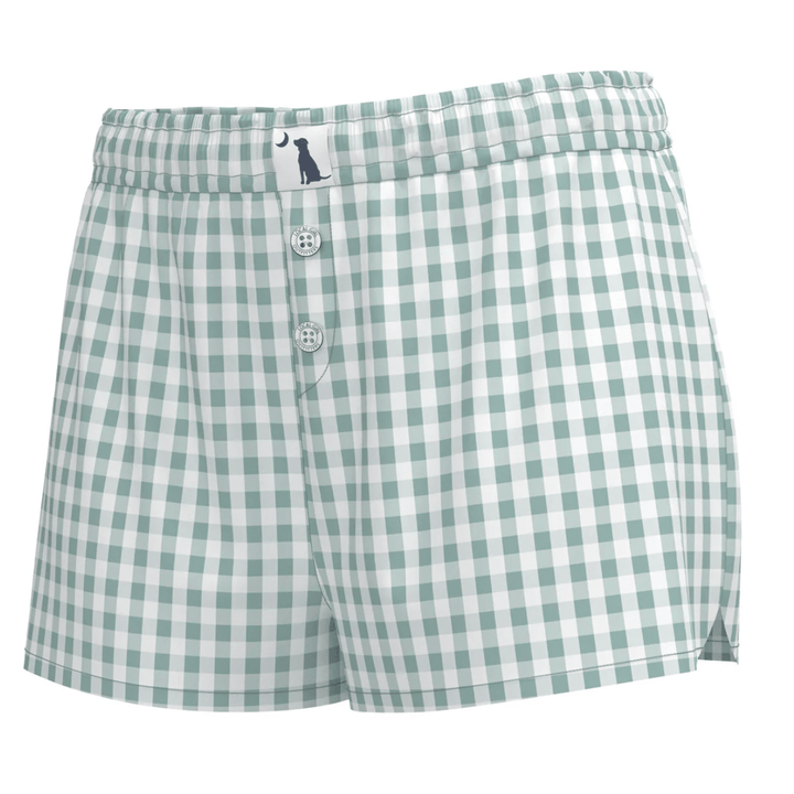 Green and white checkered shorts with a button closure on a white background