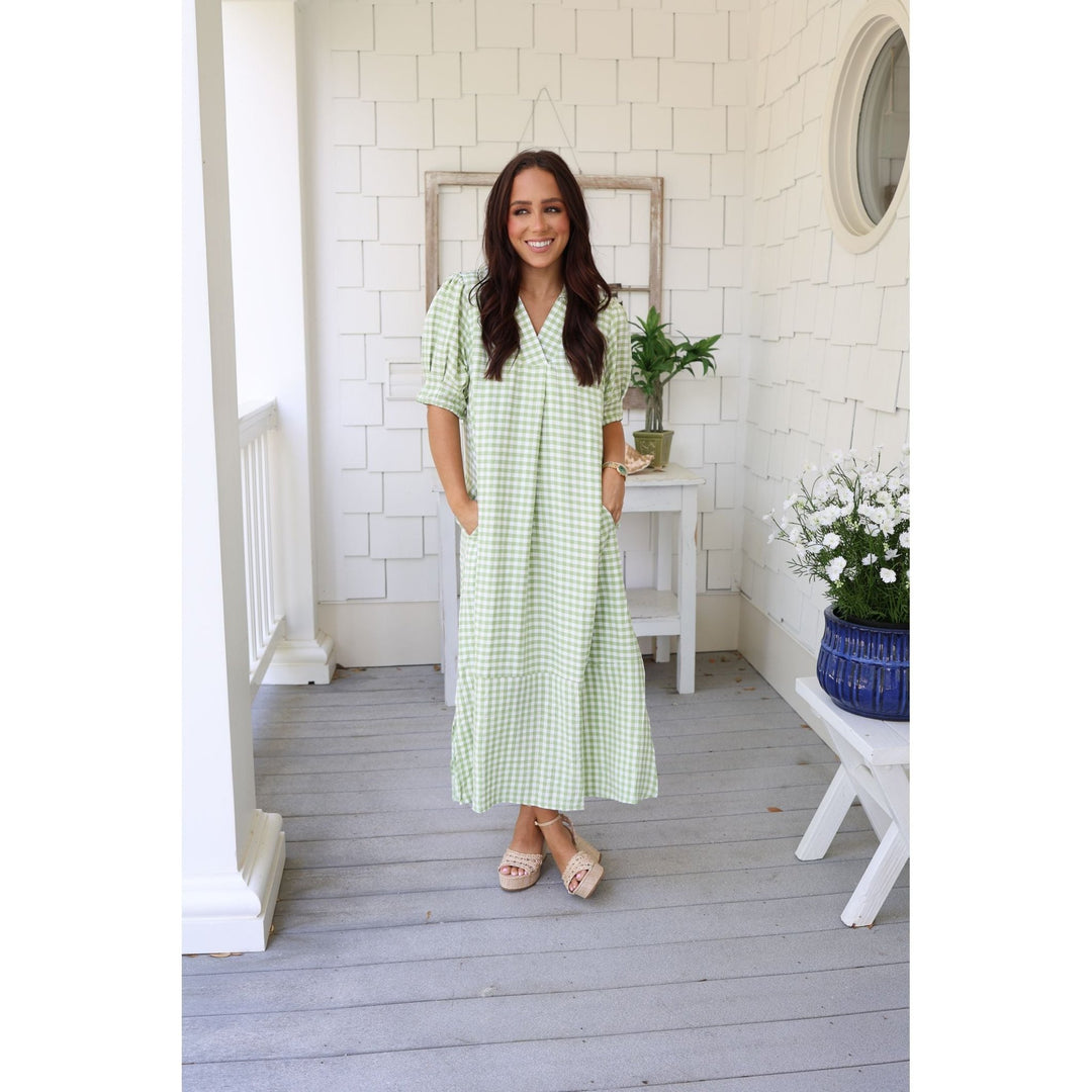 woman wearing green gingham dress