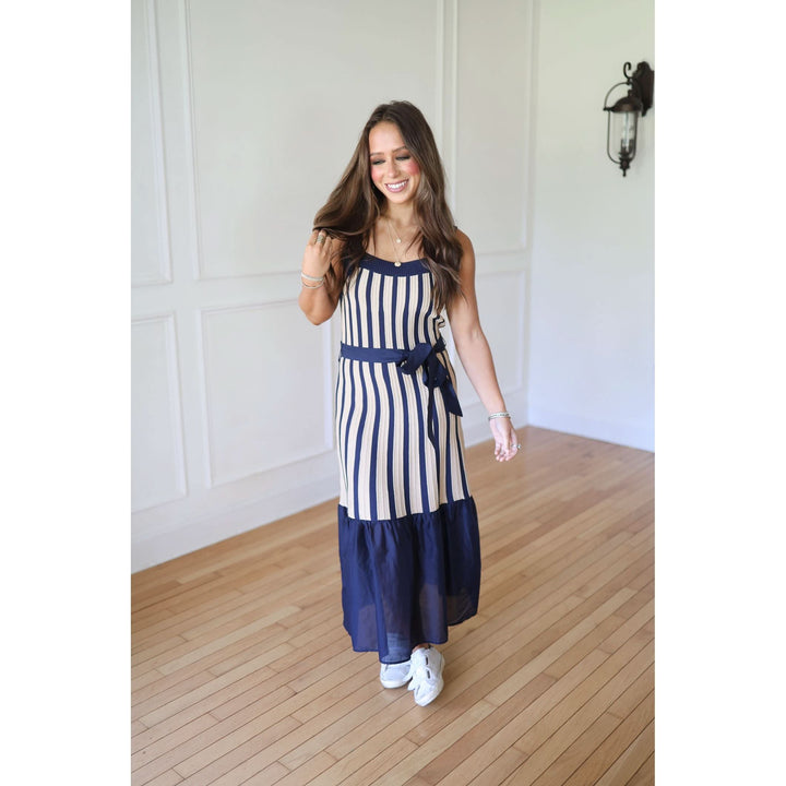 Woman wearing a blue and white striped dress 