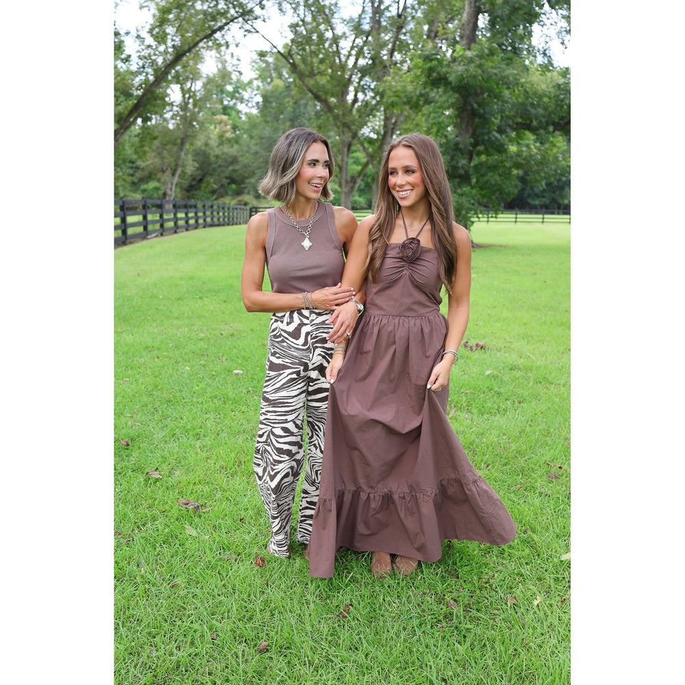 zebra pants and brown shirt