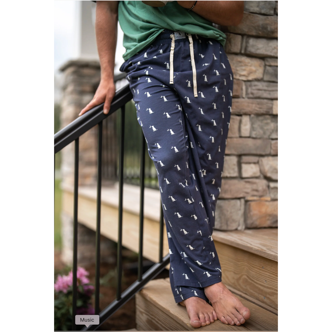 Man wearing navy blue pajama pants with a pattern