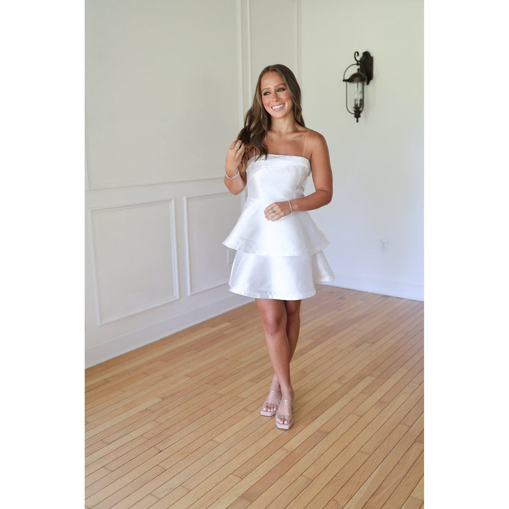 Woman in a white strapless dress 