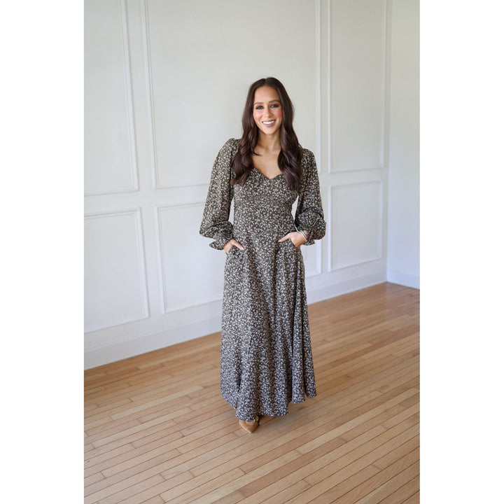 Woman wearing a long, patterned dress 